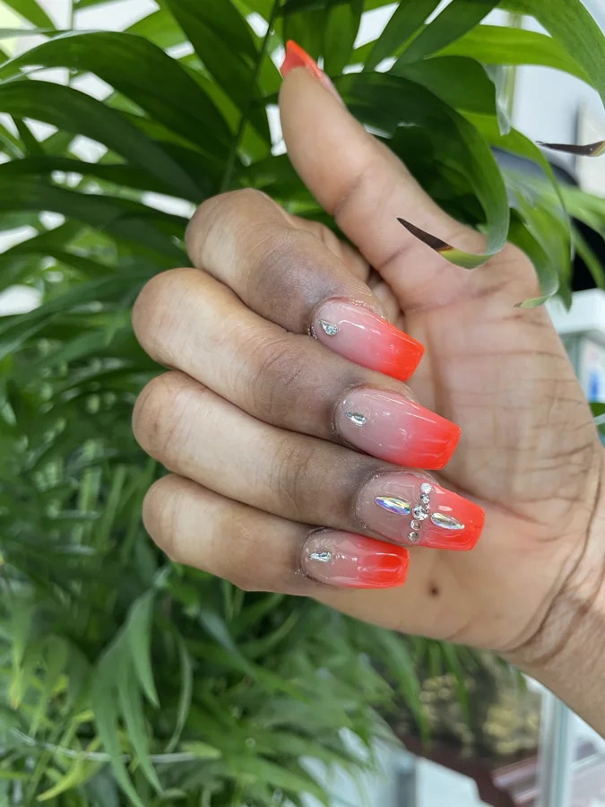 Neon coral nail design supplied by Hip Hop Nails